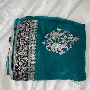 Beautiful heavy green saree with silver embroidery